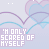 A repeating pattern of light purple and blue heart outlines with small purple sparkles, overlaid by the text "I'M ONLY SCARED OF MYSELF" in white pixelated font.
