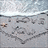 A beach scene with 'I Love You!' written in the sand, displayed on a bright blue background with pixelated text.