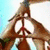 A four-quadrant image with a peace sign, heart symbol, and text reading 'when we join together there is peace' on cyan backgrounds.