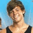 A pixelated image of a person with short brown hair wearing a black sleeveless top against a light blue background, accompanied by text reading "Life" and "Ryan <3".
