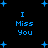 Blue pixelated text "I Miss You" repeated four times on a black background with scattered blue plus signs.
