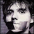 Pixelated grayscale portrait of a person with dark hair and light skin, rendered in low-resolution 256x256 pixels with visible dithering and anti-aliasing artifacts.