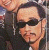 A 50x50 pixel animated buddy icon featuring a side-by-side contact sheet of two frames showing a person with dark hair and sunglasses, next to green text reading "Original Icons .com" on a dark background.