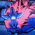 Animated pink and blue flower with a white center, showing subtle motion in petal positioning across frames.