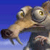 Pixelated cartoon wolf with light brown fur and green eyes, holding a dark brown object against a blue gradient background.