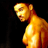 Pixelated static image of a shirtless male figure with golden-yellow skin tones against black background, viewed from side profile showing upper torso and head.