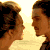 Animated contact sheet showing five sequential frames of a couple kissing on a beach at sunset.