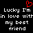 Red pixelated heart symbol above white text reading 'Lucky I'm in love within my best friend' on black background.