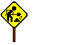 Yellow diamond-shaped road sign with black worker figure and shovel, orange cartoon character in hooded coat appears next to it.