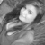 Black-and-white animated icon shows a person with long dark hair lying down, head turned slightly left, eyes open, mouth closed, wearing a dark top with light stripes.