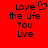 Red background with black pixelated text reading "Love the life You Live" and a heart symbol replacing the 'o' in "Love" on the left side.