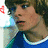 A person with brown hair and blue eyes wears a blue shirt with white trim, shown in four side-by-side with red heart symbols