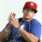 Pixelated image of a person in blue shirt and red cap clapping, with text "Daddy Yankee" and "I Love You!" on black backgrounds.