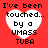 Red background with four white heart shapes containing black text reading "I've been touched... by a UMASS TUBA" in pixelated font.
