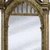 A pixelated image shows a stone archway with a white curtain behind it, overlaid with bold black text reading "It Does no Good to Dwell on Dreams. Harry".