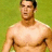 A pixelated image of a shirtless man with short dark hair standing against a green background, next to bold black text on red.