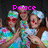 Three people in colorful patterned shirts and brown vests pose with hands clasped, wearing red sunglasses and white headbands under pink text reading Peace Love Psychedelic T-shirts.