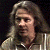 A pixelated contact sheet showing two frames of an animated icon featuring a person with long hair on the left and green text reading "Original Icons .com" on the right against a dark background.