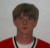 A person in a red shirt with a white undershirt and black necklace appears in with pixelated overlays and red star symbols containing the number 2