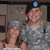 Two people in gray uniforms with blue caps stand side-by-side, one holding a child; the word 'SUNNY' appears above them.