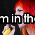 A pixelated image of a red-haired figure holding a yellow object, with partial text overlays reading "m in th" and "of Miser" against a dark background.