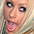 A pixelated close-up of a person with light hair, wide eyes, and an open mouth showing teeth.