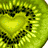 six fruit and vegetable images including a heart-shaped kiwi slice, watermelon wedge with seeds, strawberry and lime, carrot face icon, corn cobs, and text reading 'fruit and veggie <3'