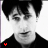 repeated black-and-white headshots with small red heart symbols scattered across the background