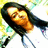 Pixelated image of a person with long dark hair lying down, face turned toward the viewer, against a bright background with yellow and green pixel clusters.