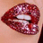 A pixelated image of lips with glittery red lipstick on a light skin tone, next to bright pink background with white text.
