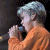A pixelated contact sheet showing two frames of an animated icon featuring a person singing into a microphone on the left and green text reading "Original Icons .com" on the right against a dark background.