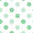 A static pattern of pixelated green circles on a white background, arranged in a grid with varying shades of light and medium green.
