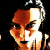 Pixelated face with dark hair and black lips appears in a , text above changes across frames