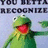 Green frog character with wide open mouth and raised arm, next to black background with green text reading 'kermit is not shy' above partially visible gray text.