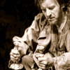 A sepia-toned animated sequence shows a person holding two goblets, with variations in posture and background elements across frames.