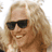 Animated sequence showing a person with long blonde hair transitioning from sunglasses to a Viking helmet while holding a 'Lords of Dog Town' sign.