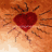A 48x48 pixel animated contact sheet showing three distinct heart-themed frames: a red heart with radiating lines on an orange background, a white heart outline in sand-like texture, and a colorful spiral pattern.