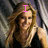 A woman with long blonde hair in a black sleeveless top appears in three with changing pink text overlays