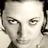Static 48x48 pixel icon showing a close-up of a person's face with dark hair, visible eyes, and partial facial features rendered in low-resolution grayscale tones.