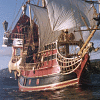 A ship with red and black hulls sails on water under a blue sky, accompanied by text stating "THE U.S.S. SUE DESTROYER" and "Destroying what you create since 2005"