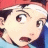 A contact sheet of two animated frames showing a pixelated anime character with red hair and blue clothing on the left, next to black background text reading "Anime IM" and "COM" on the right.