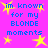 A static image with a bright pink background, yellow star shapes, and blue pixelated text reading "im known for my BLONDE moments" repeated four times.