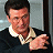 A pixelated contact sheet showing two frames of an animated buddy icon featuring a man in a dark sweater with a white collar and red text reading "Along Came Polly" on the right side.