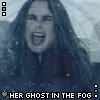 A woman with long dark hair appears in a foggy scene with snowfall, her mouth open in a scream , then closed in a third frame
