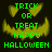 Green pixelated text 'TRICK OR TREAT HAPPY HALLOWEEN' over a yellow jack-o'-lantern face on dark background.