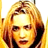 Pixelated static image of a person with light brown hair and fair skin, rendered in warm yellow-orange tones on a white background.