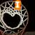A basketball hoop net with a heart-shaped cutout, featuring orange text overlays reading "I", "Love", and "basketball" across different frames.