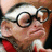 Pixelated image of a person with glasses and a red shirt, with text reading 'grandpa', 'monkey', and a question mark on a dark blue background.