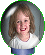 Circular portrait of a girl with light brown hair and red lips, wearing a white top with blue trim, against a gray background with a green outline.