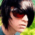 A person with short dark hair and red-tinted sunglasses appears in three views against a green background, showing slight head position shifts.